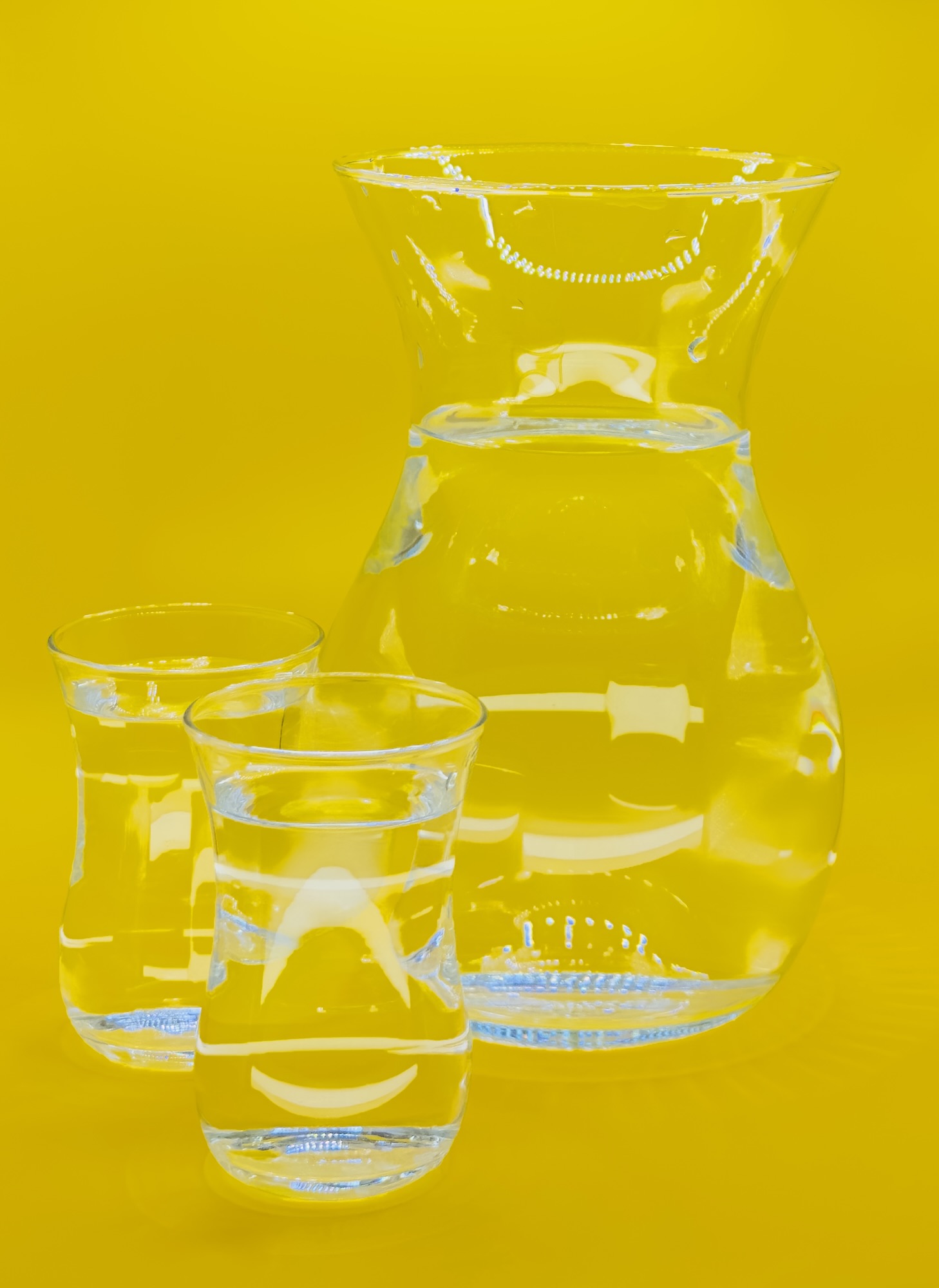 A glass jug glowing with energy, filled with water, symbolizing revitalization and health.